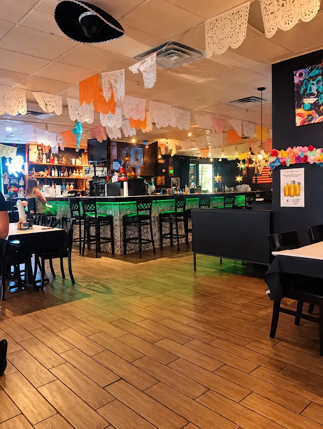 Updated view of the Chicanos dining room and bar with papel picado decorations
